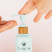 body wash being dispensed from a bottle
