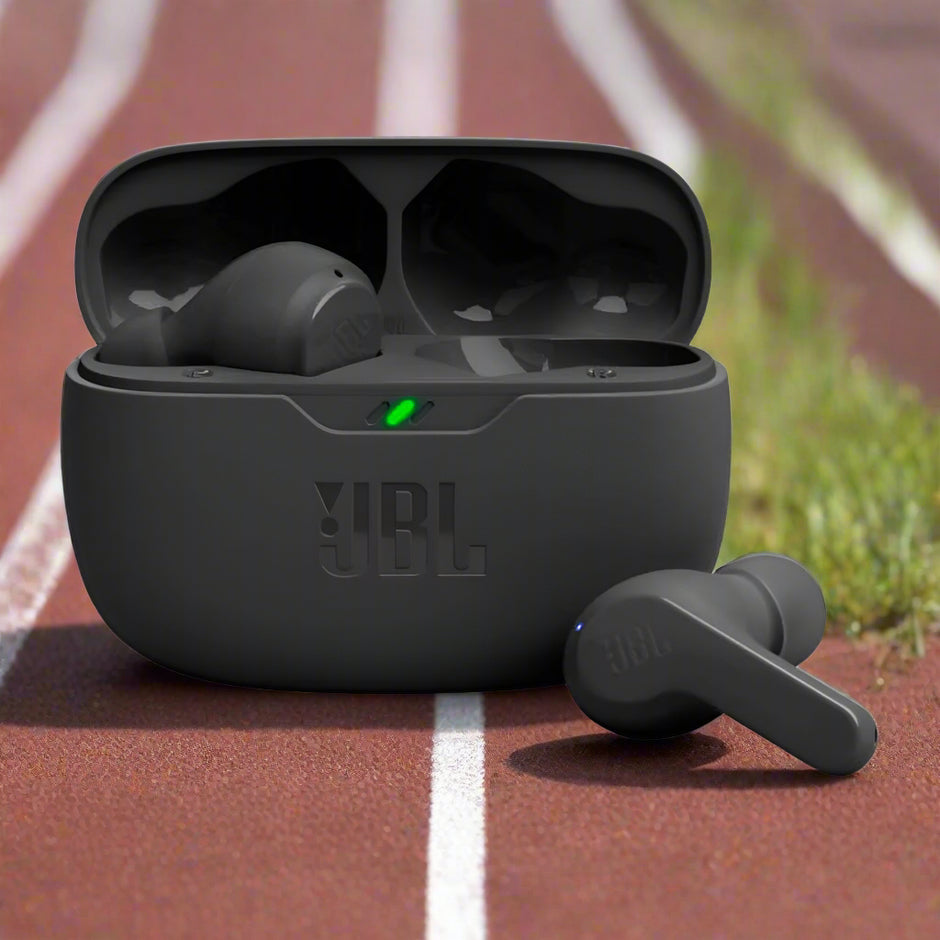 Black JBL wireless earbuds with charging case displayed being charged