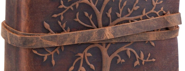 Brown leather journal with tree design Leather Loves Me Innovative crude selected items. Customer approved. Sale. Tree. Gifts. Any age. Any sex. Any occasion. Friends Harry and family. Coworker. Neighbor. Cousin. Sister.