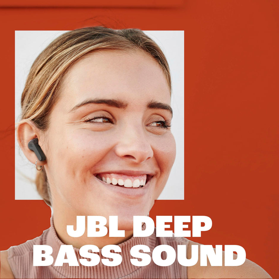 Woman wearing a JBL earbud with 'JBL Deep Bass Sound' text 