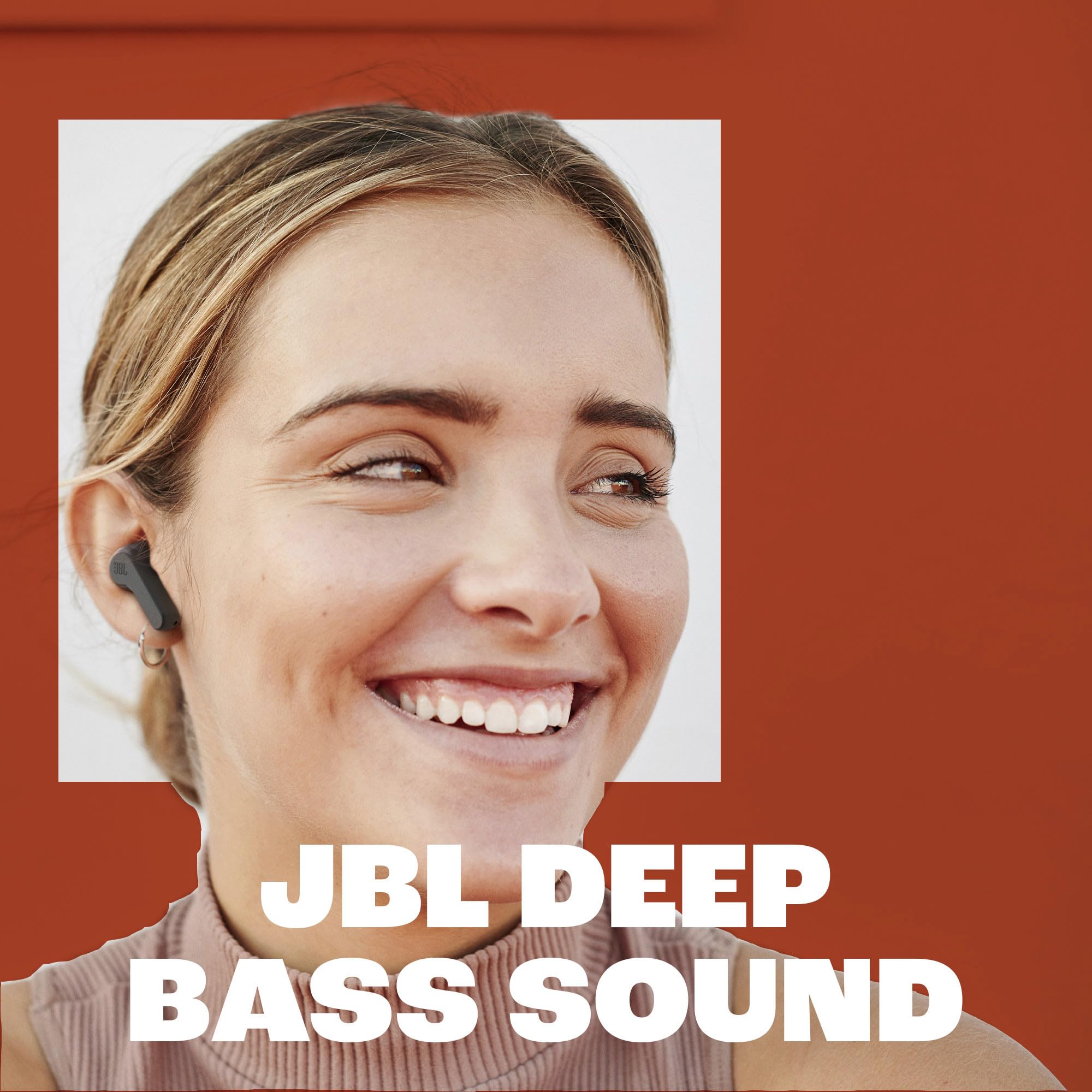 Woman wearing a JBL earbud with 'JBL Deep Bass Sound' text 