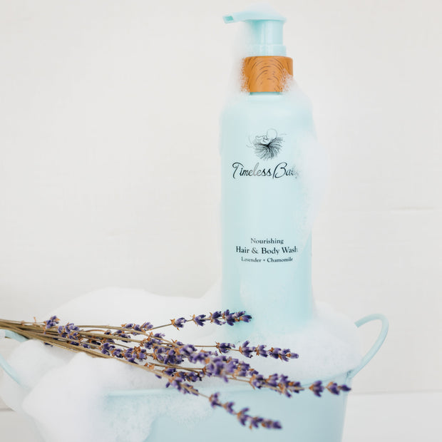 Blue bottle of Timeless Babe hair and body wash with lavender flowers Water-Free