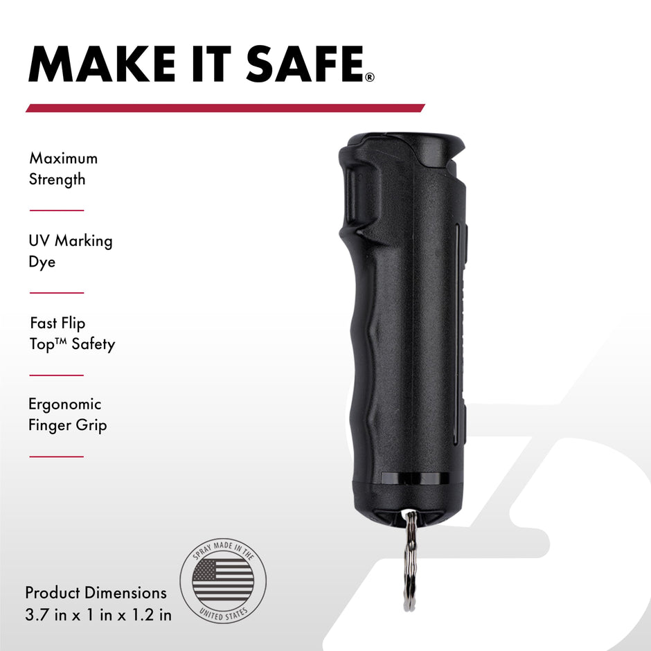 Black pepper spray device with safety features and product dimensions on a white background
